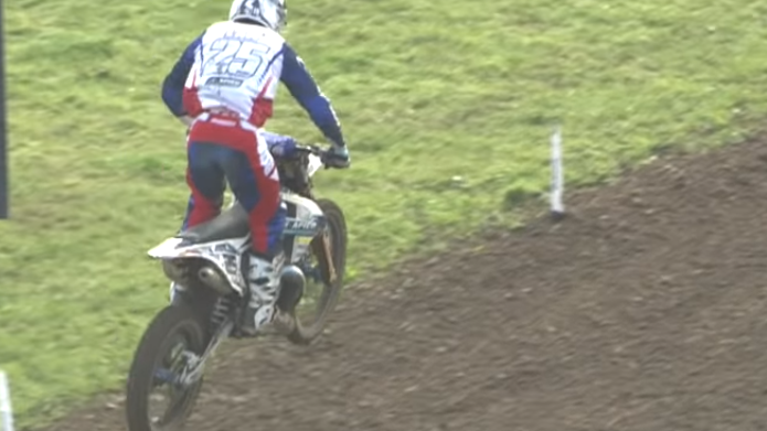 Motocross rider snaps his bike in two with a heavy landing
